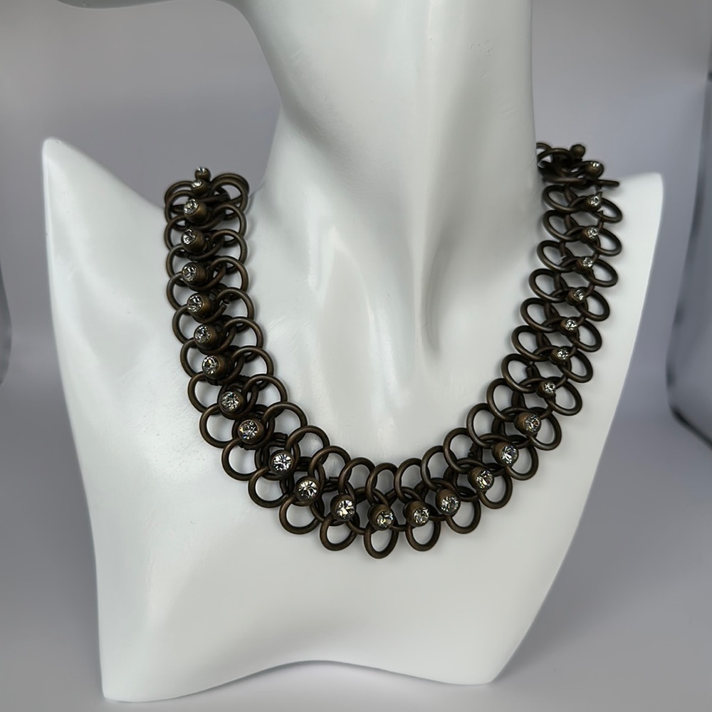 Jean Paul Gaultier bronze chain is the perfect blend